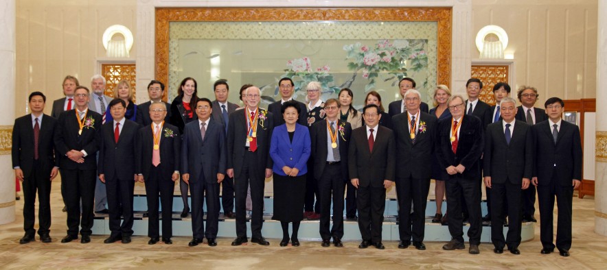 University of Utah organic chemist Peter J. Stang (front row, fourth from right) stands with other winners (wearing gold ribbons with medals) of China’s International Science and Technology Cooperation Awards and a number of officials in the Great Hall of the People in Beijing on Jan. 8, 2016. At center in blue jacket is Liu Yandong, vice premier of the People’s Republic of China.