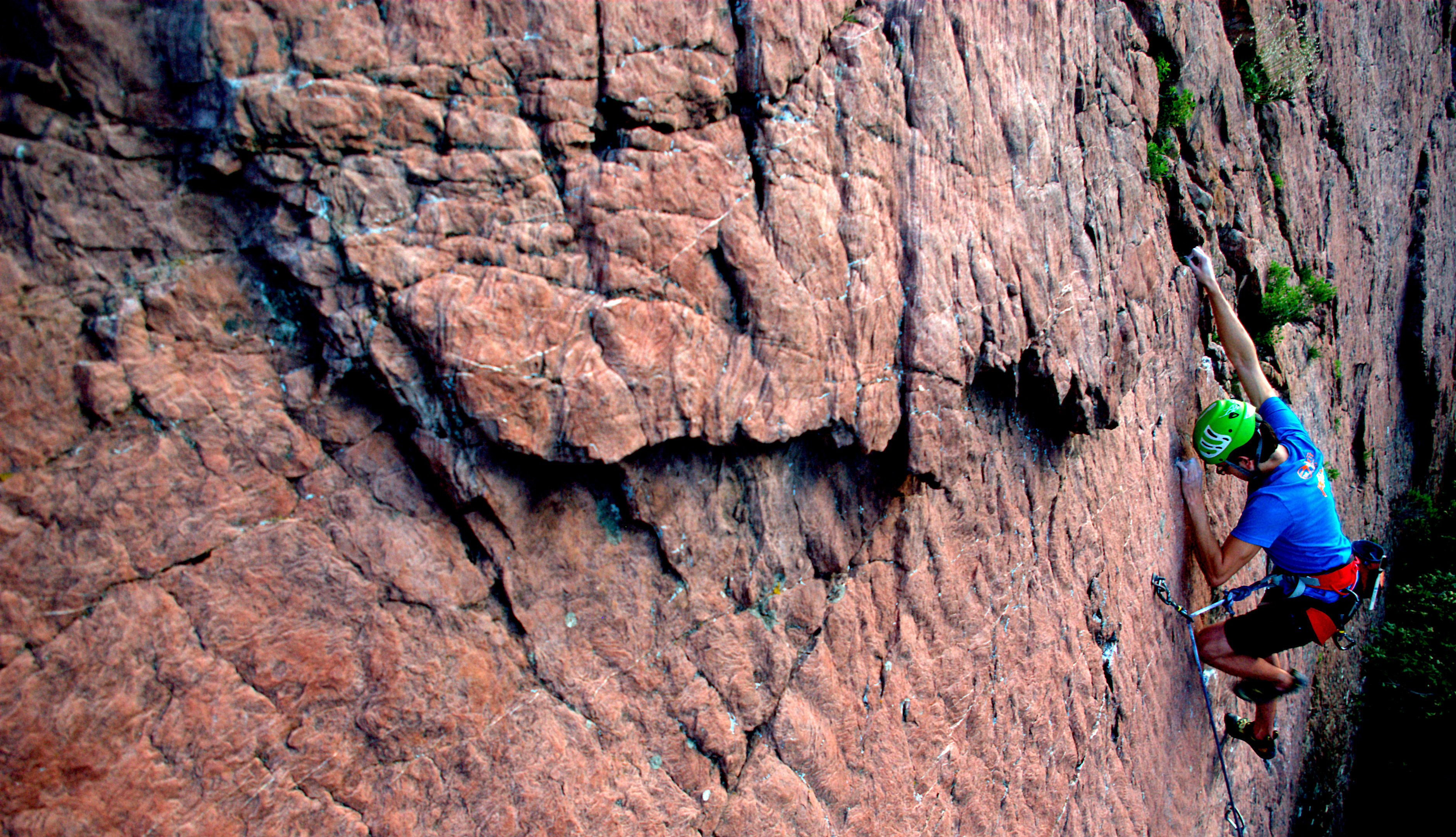 Trevor Dick, shown rock climbing with a rope in Parley’s Canyon near Salt Lake City, is among four University of Utah mathematicians who published a new study showing it is mathematically possible to design an ideal, dynamic climbing rope that would brake a falling climber like the gradual application of brakes decelerate an automobile. 