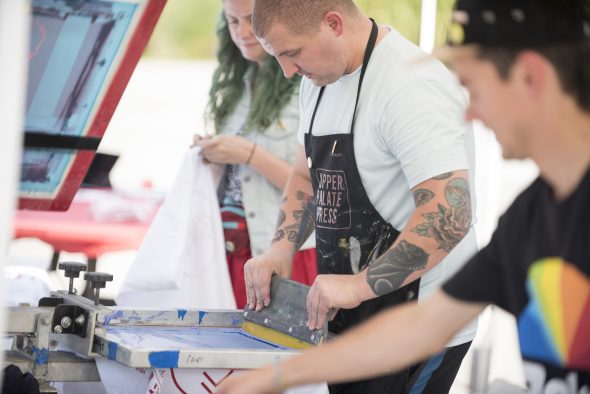 Art & Art History alumnus, Brian Taylor, screen printing at Arts Bash