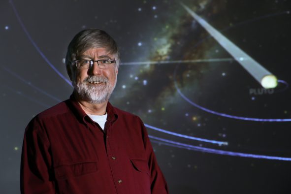 Computer scientists at the University of Utah's Scientific Computing and Imaging Institute led by Charles Hansen are co-developing 3-D software for planetariums and home computers called OpenSpace (pictured in the background) that recreates space phenomena based on NASA data.