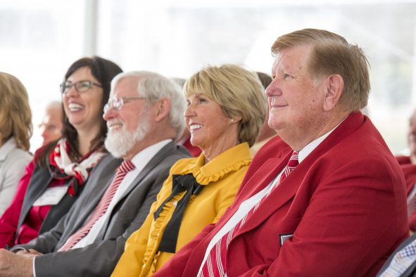 Kem and Carolyn Gardner with U President David W. Pershing at the unveiling ceremony for the new building named after the Gardners.